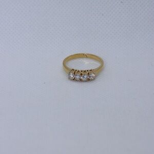 Goldtone four CZ diamond ring